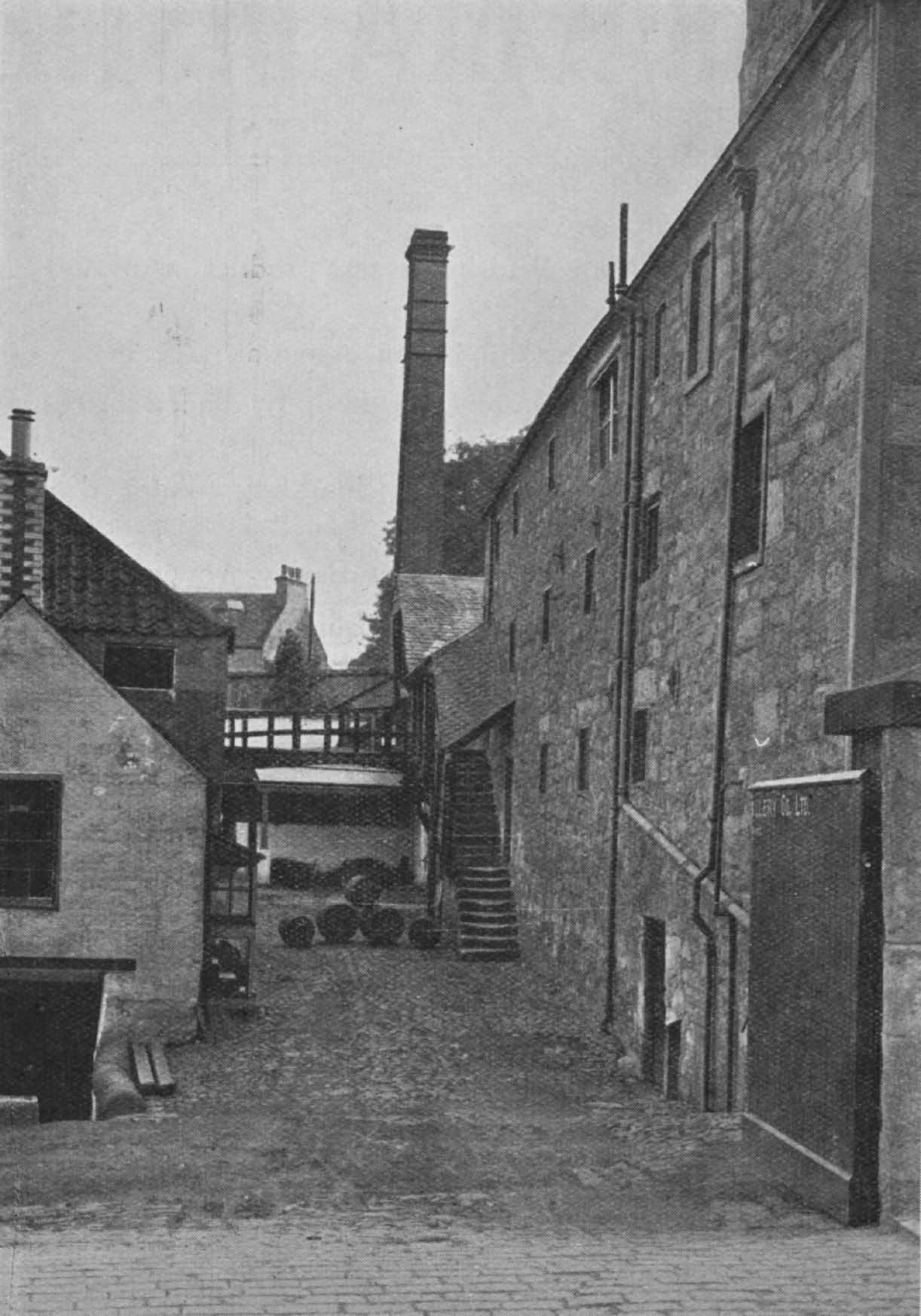 Isla : Malt barns, right. Washback room and draff store, left. Note the age of the buildings as shown by the worn steps leading to malt barns.